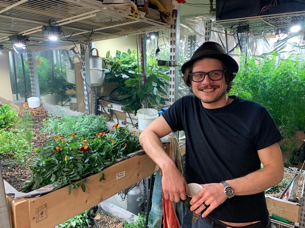 Founder in a hydroponic garden